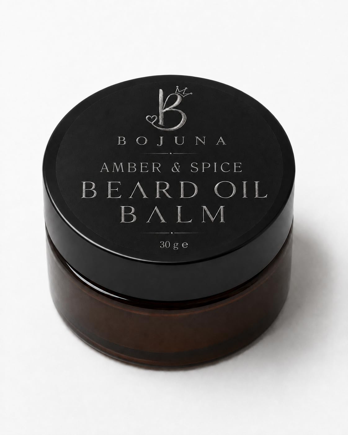 A 30g jar of Bojuna Amber & Spice Beard Oil Balm, featuring a black lid with silver lettering and a dark amber-brown glass container, set against a clean white background.