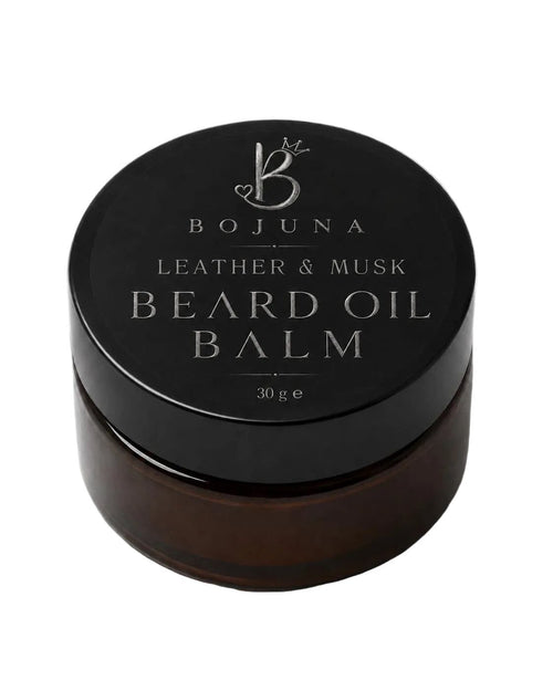 A dark brown glass jar of Bojuna Leather & Musk Beard Oil Balm with a black lid, photographed on a clean white background.