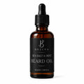 A 50ml amber glass dropper bottle of Bojuna Sea Salt & Mint Beard Oil, featuring a black label and a black dropper cap, set against a plain white background.
