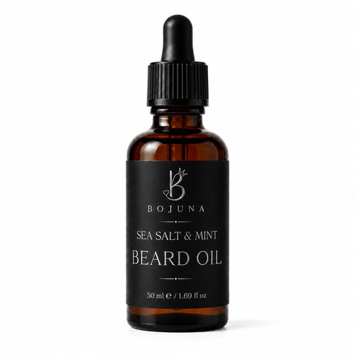 A 50ml amber glass dropper bottle of Bojuna Sea Salt & Mint Beard Oil, featuring a black label and a black dropper cap, set against a plain white background.
