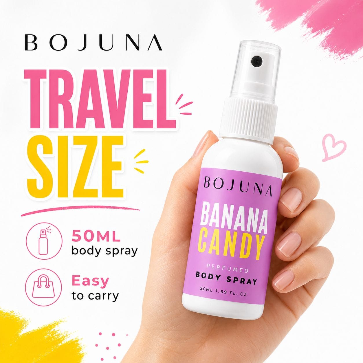 A hand holding a 50ml travel-size spray bottle of Bojuna Banana Candy body spray against a white background with pink and yellow graphic text and paint strokes.
