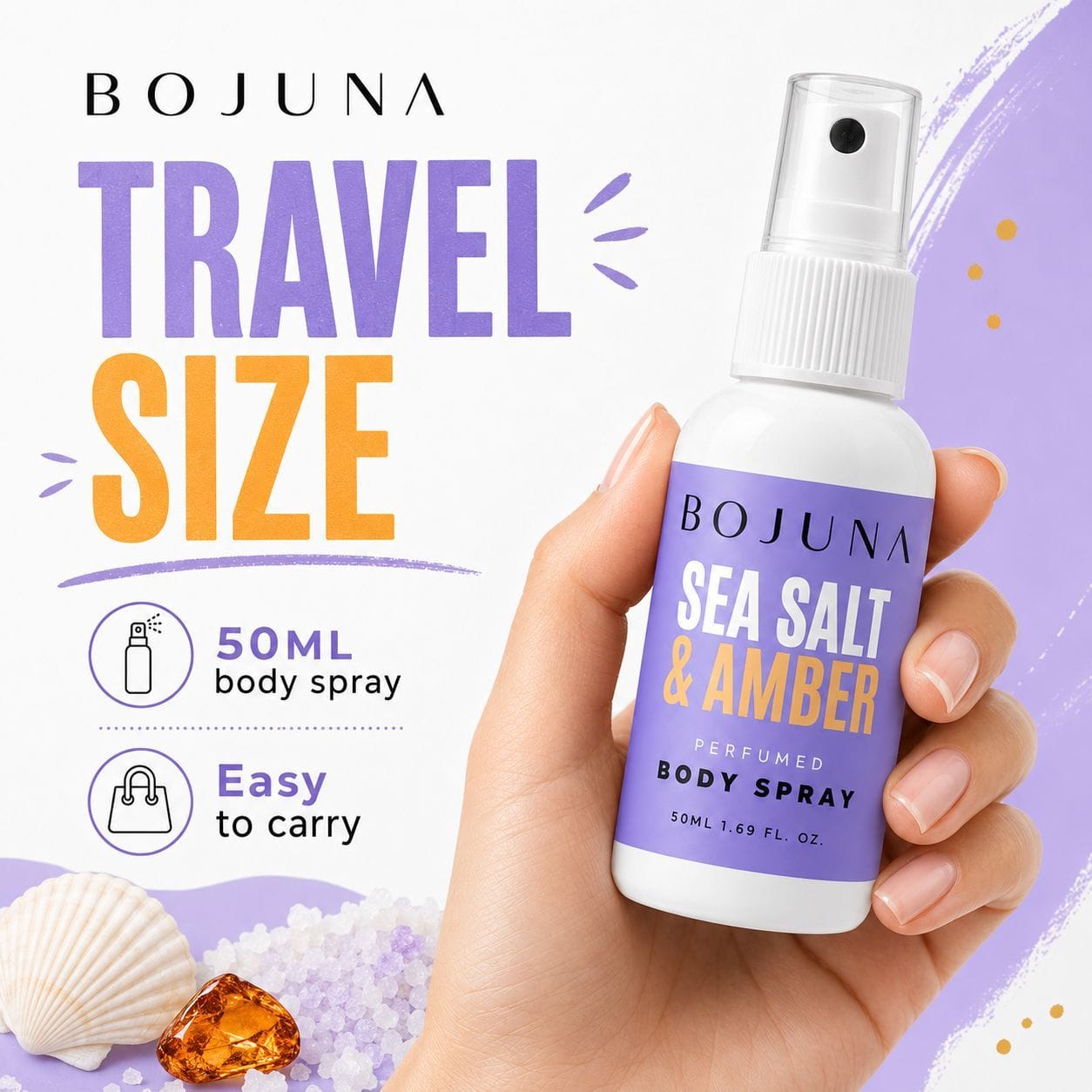 A hand holds a small white BOJUNA Sea Salt & Amber travel-size body spray bottle with a purple label. The image includes promotional text reading 'TRAVEL SIZE,' '50ML body spray,' and 'Easy to carry,' with decorative seashell and amber crystal graphics on a white and lavender background.
