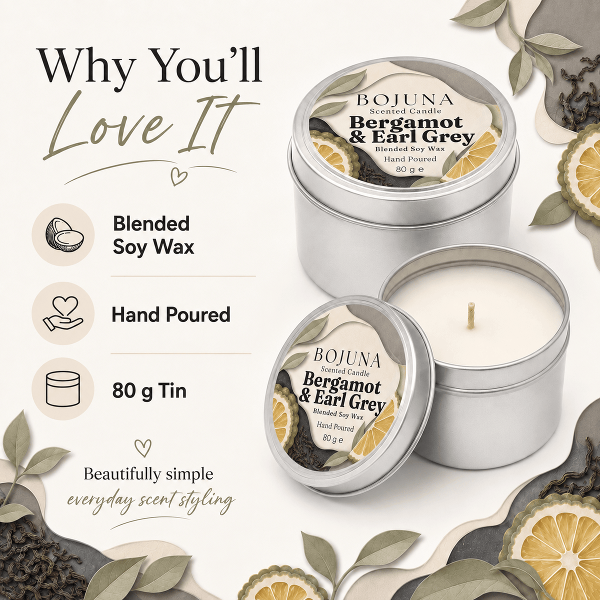 Two silver tin candles from Bojuna Scents, one open showing white soy wax and one closed, on a styled cream background with text highlighting features like blended soy wax, hand pouring, and 80g tin. Decorative leaves, tea leaves, and sliced citrus are arranged around the product.