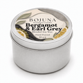 A round silver metal tin candle with a white lid label reading BOJUNA Bergamot & Earl Grey, shown on a clean white background.