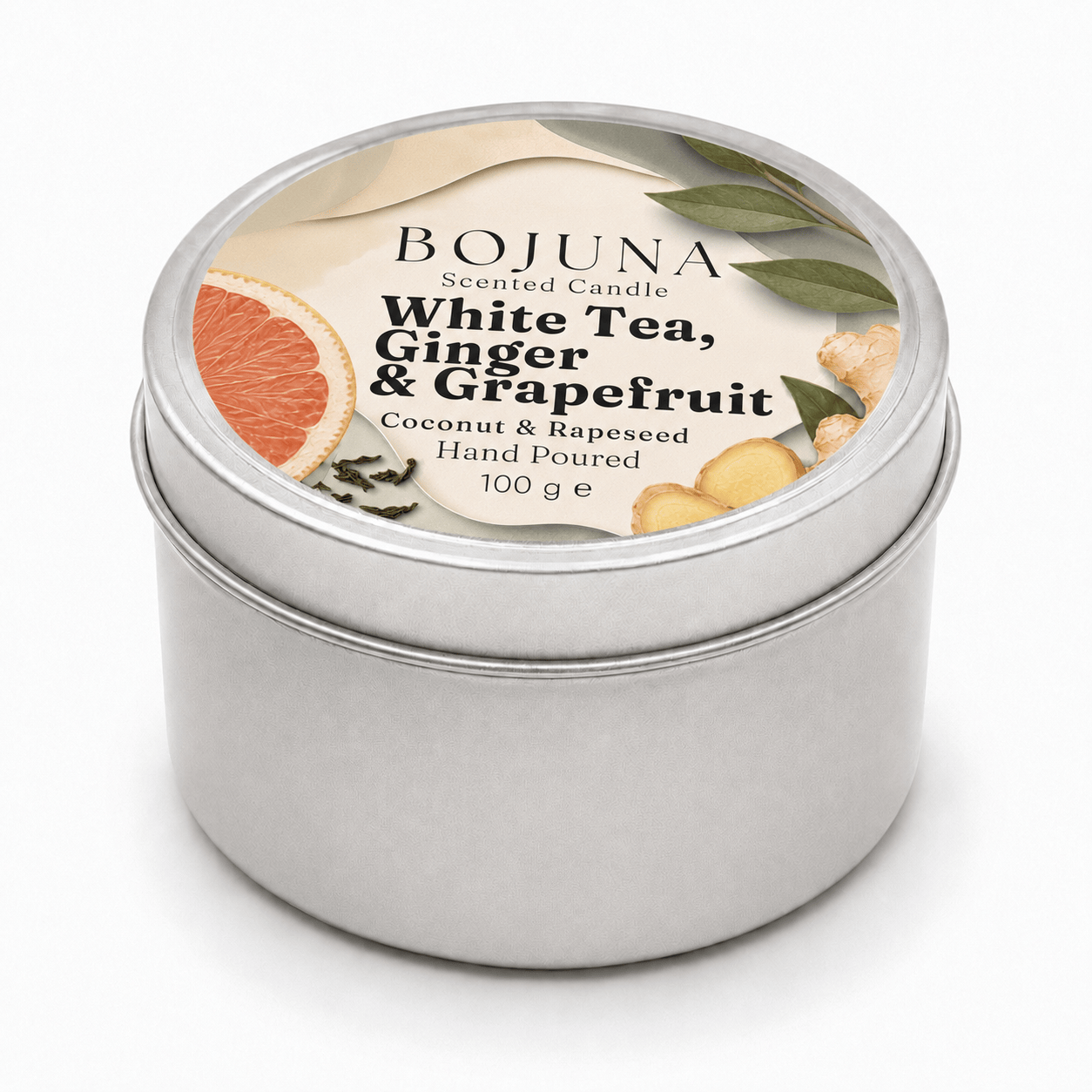 A round silver metal tin candle with a white lid label reading BOJUNA White Tea, Ginger & Grapefruit, on a clean white background.
