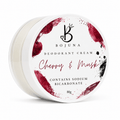 A round white jar of Bojuna Deodorant Cream in the Cherry & Mask scent, featuring a white lid with red and black cherry-themed watercolor splatters and text.