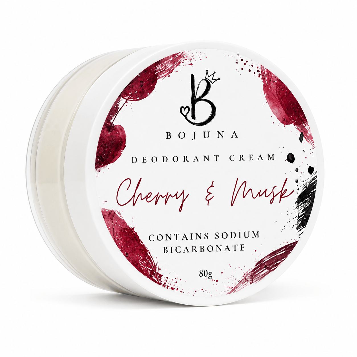 A round white jar of Bojuna Deodorant Cream in the Cherry & Mask scent, featuring a white lid with red and black cherry-themed watercolor splatters and text.