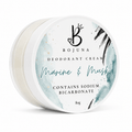 A round white plastic tub of Bojuna Deodorant Cream in the 'Marine & Musk' scent, featuring a watercolor design with teal, black, and gold accents on the lid.