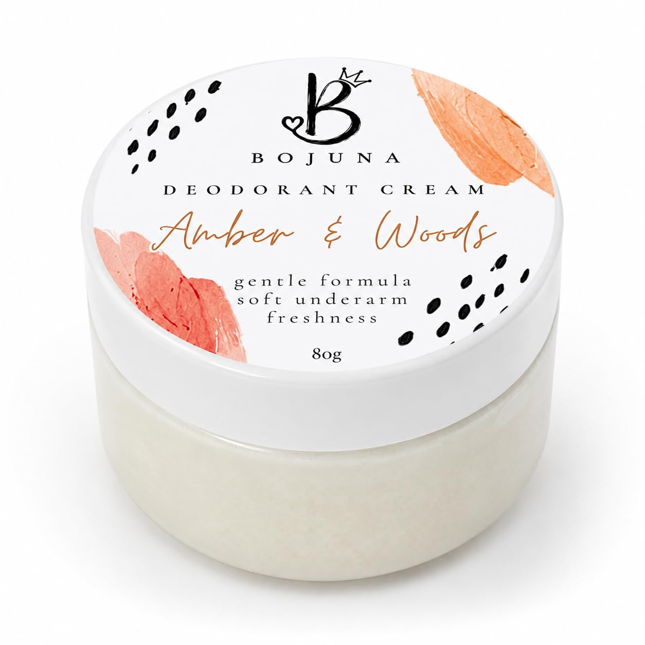 A 80g jar of Bojuna Deodorant Cream in the 'Amber & Woods' scent, featuring a white lid with coral floral illustrations and black polka dots, set against a clean white background.