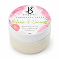 A 80g jar of Bojuna Deodorant Cream in the 'Citrus & Coconut' scent. The product is shown in a clear plastic jar filled with off-white cream, topped with a white lid featuring a pink tropical leaf pattern and black branding.