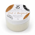 A 80g jar of Bojuna Oud & Bergamot Deodorant Cream, featuring a white lid with gold and black abstract designs and a white jar containing the cream.