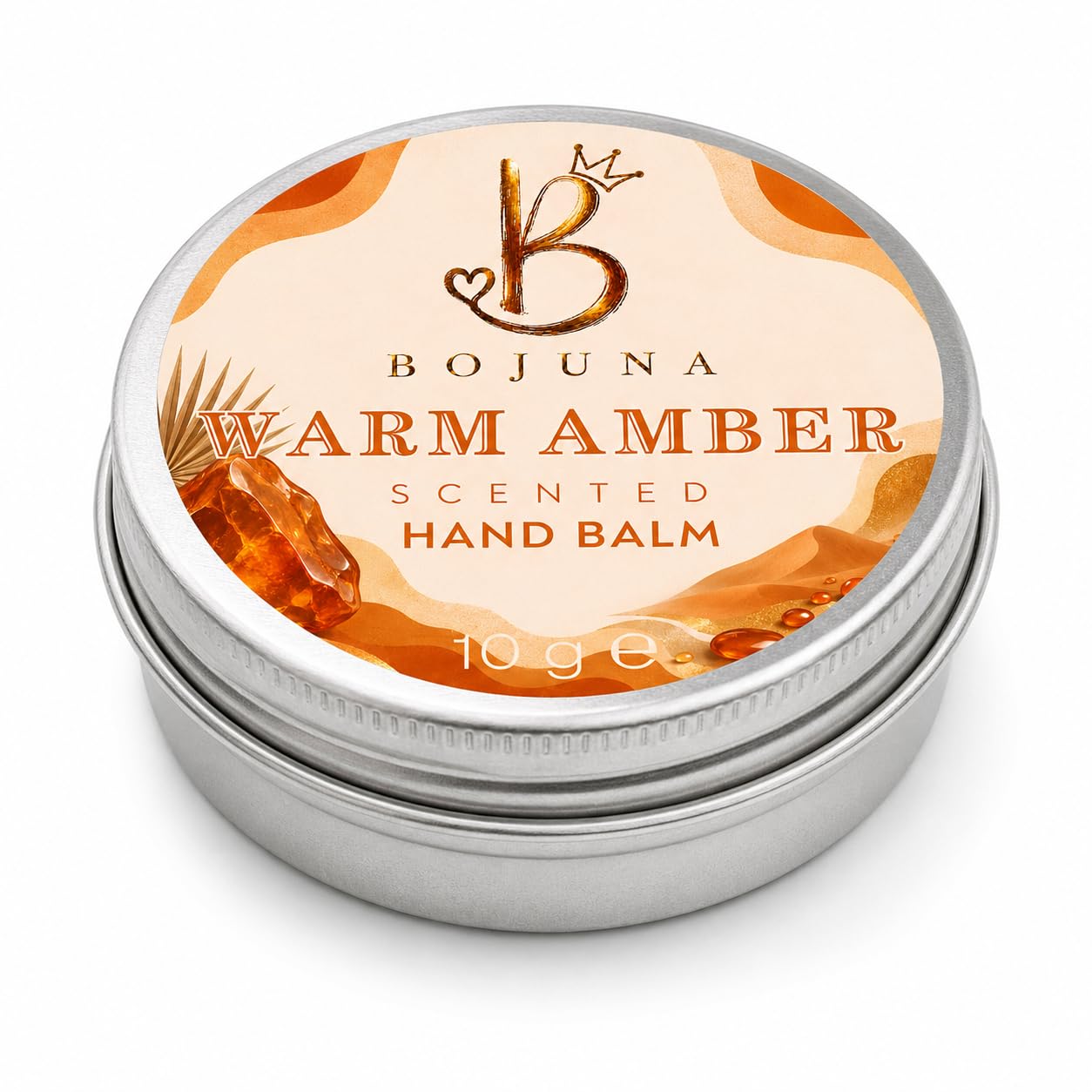 A round silver metal tin of Bojuna Warm Amber Scented Hand Balm, featuring a cream and orange label with amber graphics, on a white background.