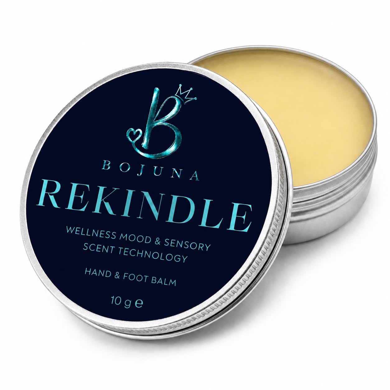 An open round metal tin of Bojuna Rekindle hand and foot balm, showing the pale yellow balm inside, with the lid leaning in front displaying a dark navy label with light blue text.