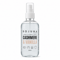 A 250ml clear glass spray bottle of BOJUNA HOME Cashmere & Vanilla Linen & Fabric Spray with a white pump dispenser, shown on a clean white background.