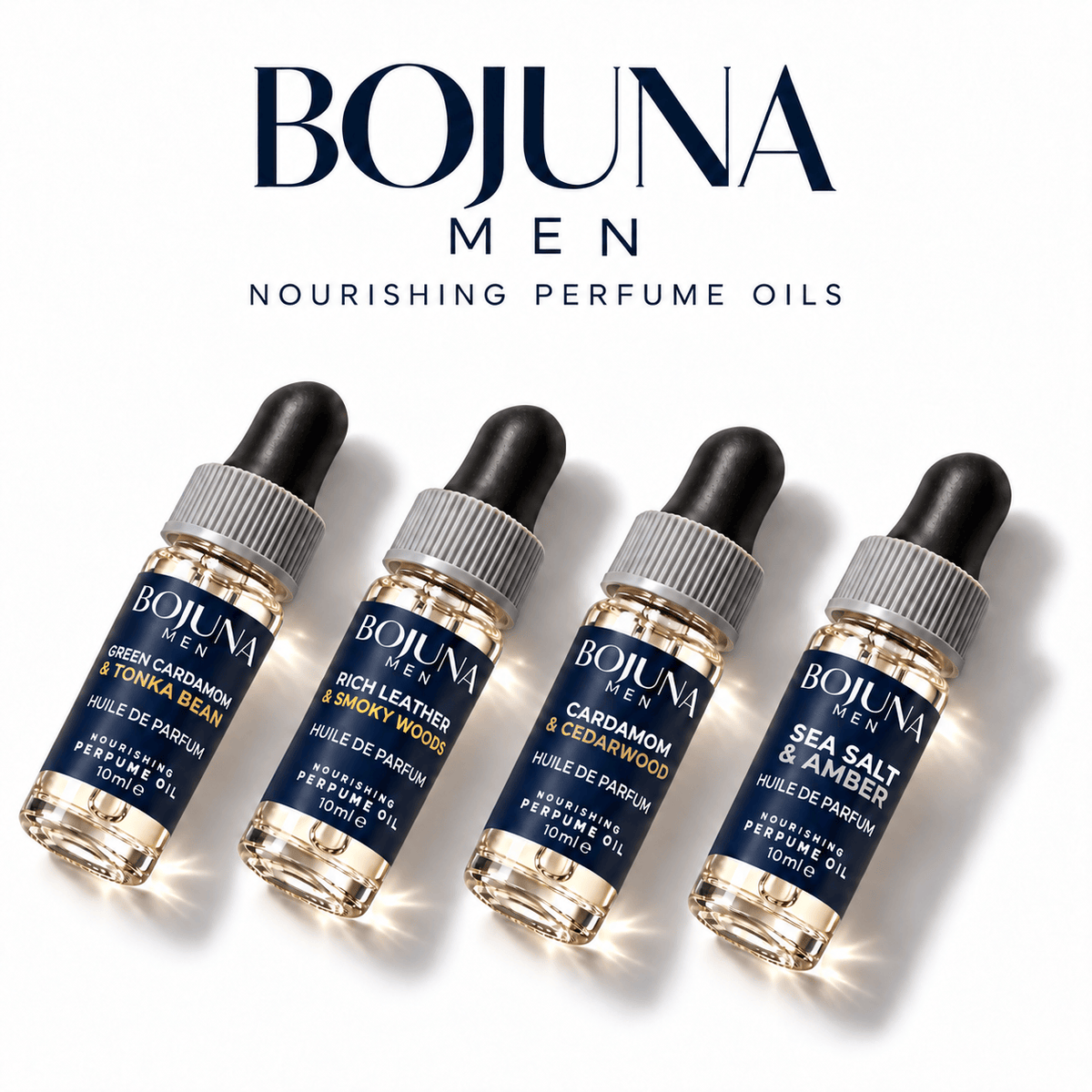 Bojuna Men nourishing perfume oils in four navy-labelled 10 ml dropper bottles with white first scent lines, arranged diagonally on white.