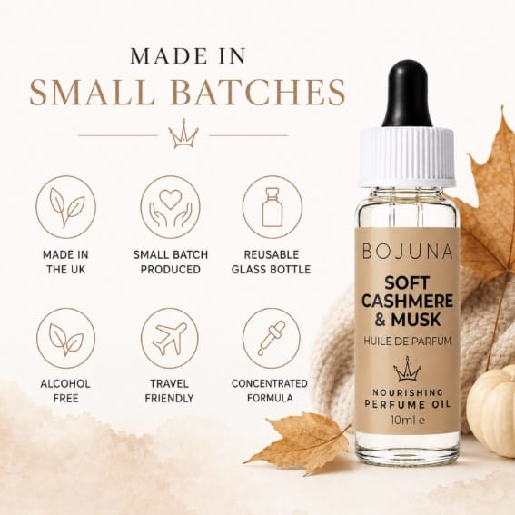A 10ml bottle of BOJUNA Soft Cashmere & Musk nourishing perfume oil on a warm beige background with autumn leaves and text highlighting small-batch production, alcohol-free formula, reusable glass bottle, and travel-friendly packaging.