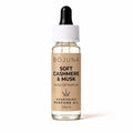 A 10ml bottle of BOJUNA Soft Cashmere & Musk Nourishing Perfume Oil, featuring a beige label, clear glass bottle, white cap, and black dropper, set against a plain white background.