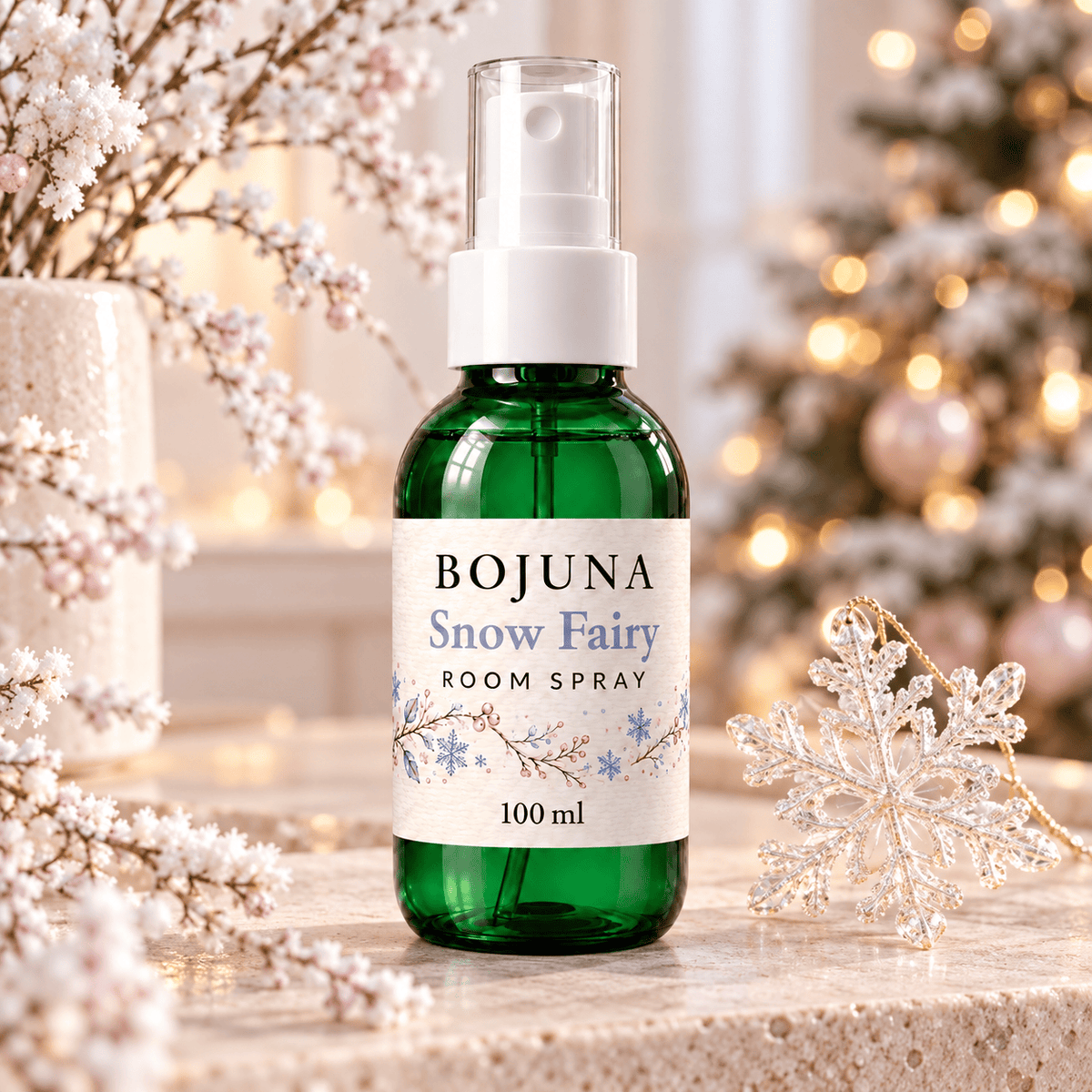 Bojuna Snow Fairy Room Spray 100 ml in an elegant Christmas setting with soft festive lights.