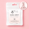 A white stand-up pouch of Bojuna Scented Vacuum Discs in the 'Earl Grey & Cucumber' scent, shown on a solid pink background with a promotional badge in the top right corner.