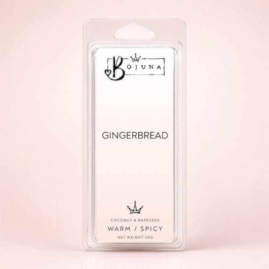 Bojuna Gingerbread scented wax melts in a clear plastic clamshell package, set against a soft pink background.