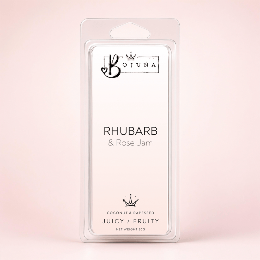 A packaged wax melt or scented melt package labeled 'BOJUNA RHUBARB & ROSE JAM' in a clear plastic clamshell on a soft pink background.