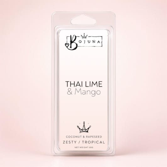Bojuna Thai Lime & Mango wax melts in a clear plastic clamshell package, set against a soft pink background.